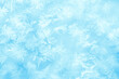 Winter Frost texture iced surface. Textured cold frosty surface of ice. Frost on the glass, freezing effect. Blue ice surface as background for advertising. Ice crystals or cold winter background. 