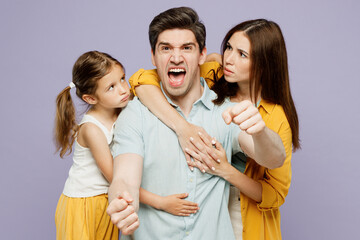 Young furious parents mom dad with child kid daughter girl 6 year old wear blue yellow casual clothes hold car like driving, hug pov safety belt isolated on plain purple background Family day concept