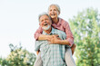 © Lumos sp - woman man outdoor senior couple happy lifestyle retirement together smiling love fun elderly active vitality nature mature portrait piggyback game