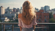 © PETR BABKIN - young woman looks at the city from the balcony on a sunny day. Generative Ai.