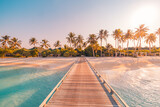 Fototapeta Natura - Amazing sunset panorama at Maldives. Luxury resort villas seascape with soft led lights under colorful sky. Beautiful twilight sky and colorful clouds. Beautiful beach background for vacation holiday