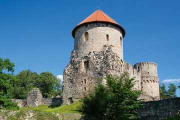 Wall Mural - Latvian tourist landmark attraction - Ruins of the medieval Livonian castle, stone walls and towers  in Cesis, Latvia.