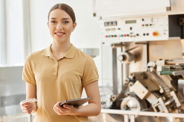 Wall Mural - Waist up portrait of smiling young woman working at pharmaceutical factory and looking at camera, copy space