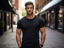 Male Model In A Classic Black Cotton T-shirt On A City Street