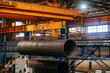 © Mulderphoto - Finished pipe transportation by overhead crane in pipe factory