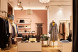 © Seventyfour - Background image of elegant clothing boutique interior with clothes and accessories on display, copy space