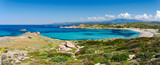 Fototapeta  - Panorama de la plage de Stagnolu dans le sud de la Corse à côté de Bonifacio. Mer turquoise et rochers sur un fond de montagnes.
