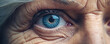 close up of face old woman wrinkles and blue eye detail. wide banner