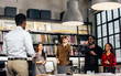 © Ann Rodchua - Group of diverse and multiracial businesspeople wearing casual clothes for work, meeting and brainstorming about project and marketing plan in modern indoor meeting room at office. Business Concept.