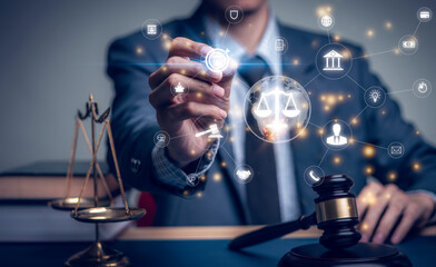 Lawyer's hand concept Justice with Judge gavel, Businessman in suit or Hiring lawyers in the digital system. Legal law, prosecution, legal adviser, lawsuit, detective, investigation,legal consultant.