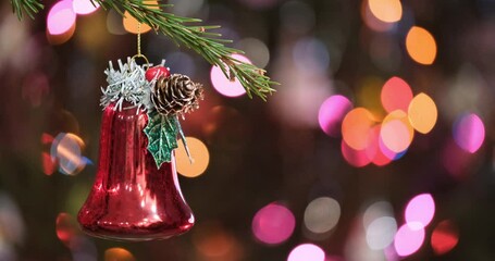 Aufkleber - Christmas tree decorated red bell toy, Fir branch bell and festive lights on the Christmas background with sparkle and bokeh