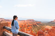 © travnikovstudio - Hiker woman in Bryce Canyon hiking relaxing looking at amazing view during hike on summer travel in Bryce Canyon National Park, Utah, United States.