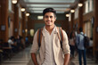 © Starmarpro - Young smiling indian student standing in univesity hall. High quality photo