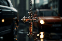 Cross Pendant Dangling From Rear View Mirror Of A Parked Car