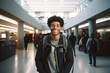 Young smiling african american student standing in university hall. High quality photo