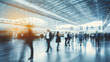 © Nico Vincentini - Blurred figures of business professionals strolling at an expo, conference, or within a contemporary hall, demonstrating motion speed blur, broad panoramic bannerGenerative AI