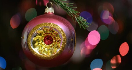 Aufkleber - Christmas tree decorated red ball toy, Fir branch with balls and festive lights on the Christmas background with sparkles and bokeh