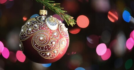 Aufkleber - Christmas tree decorated red ball toy, Fir branch with balls and festive lights on the Christmas background with sparkles and bokeh