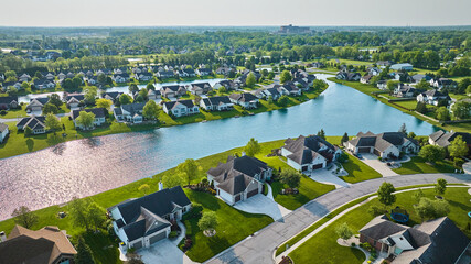 Wall Mural - Pondside houses in rich expensive neighborhood housing addition with landscaped properties