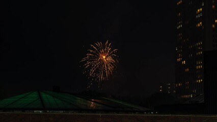 Wall Mural - time lapse of a colorful fireworks display near residential condominium highrise buildings in chicag