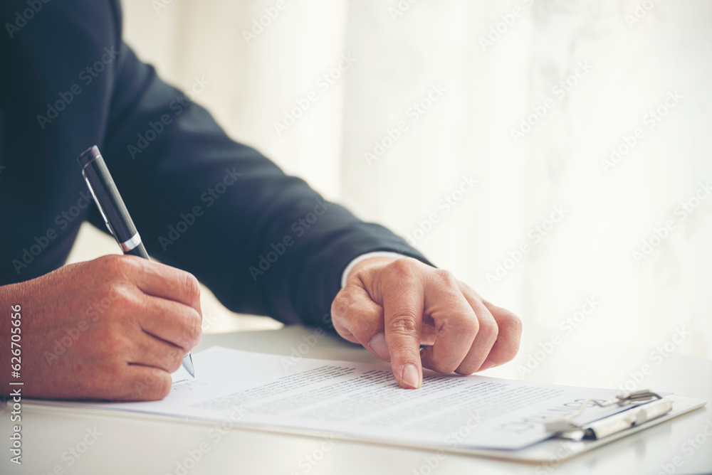 Businessman hand using pen signing on new contract to starting projects ...