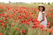 © Evgenia Tiplyashina - A girl in a poppy field
