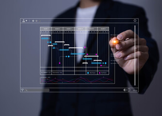 Fototapete - business manager managing business planning project schedules in the office. Gantt chart showing on virtual screen.	
