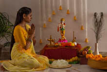 Woman Praying To Lord Krishna On The Occasion Of Janmashtami