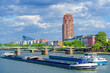 Two barges sail the River Main in Frankfurt, Germany