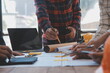 © Sirikarn Rinruesee - Engineer Teamwork Meeting, Drawing working on blueprint meeting for project working with partner on model building and engineering tools in working site, Construction and structure concept.