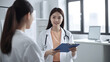 © Yeti Studio - Female doctor communicating with her colleague in her medical office