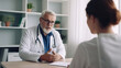 © Yeti Studio - Male doctor communicating with a patient in his medical office