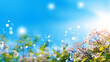 Blurred spring background with bokeh defocused lights and flowers