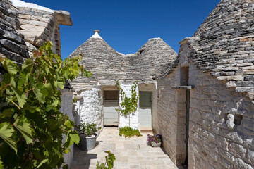 Wall Mural - The Trulli of Alberobello, the typical limestone houses in the province of Bari, Puglia, Italy