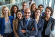© Surachetsh - A diverse group of businesspeople poses for a professional team photo, exuding confidence and professionalism, while looking smart and impeccable. Generative AI.
