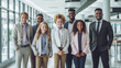© Surachetsh - A diverse group of businesspeople poses for a professional team photo, exuding confidence and professionalism, while looking smart and impeccable. Generative AI.