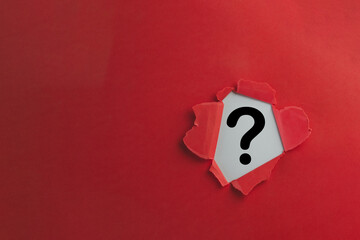 Problem,Confusion,Answer,Decisions,Sign and Symbol,FAQ concept.,Black Question Mark icon in Breakthrough red paper hole with white background.
