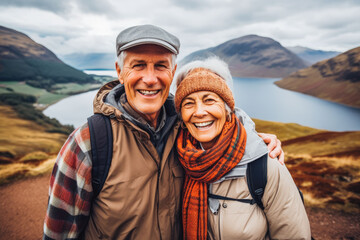 Wall Mural - Multiethnic couple traveling in Scotland in summer. Happy older travelers exploring in nature.