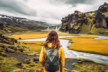 Wall Mural - Woman traveling in Iceland in summer. Happy young traveler exploring in nature.