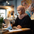 © DALU11 - Muslim woman working with the laptop. Generative AI.
