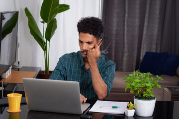 Brazilian Black Business Man Working at Home. Young Man Doing Home Office During the day at desk With Laptop