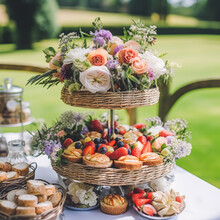 Summer Garden Harvest, Farmers Market And Country Buffet Table, Cakes And Desserts In Wicker Basket In The Garden, Food Catering For Wedding And Holiday Celebration, Floral Decor