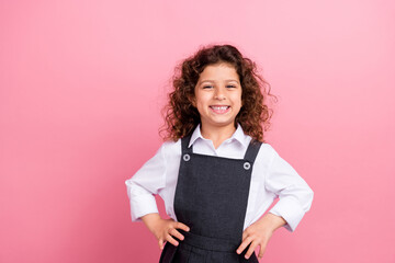 Wall Mural - Portrait of lovely confident girl toothy smile put hands waist empty space ad isolated on pink color background