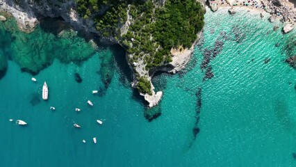Wall Mural - view from the air on the waves and rocks. sea relaxation and travel. azure water on the sea. a brigh