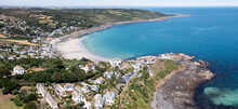 Aerial View Of The Cornish Fishing Village Of Coverack And Its Sandy Beach