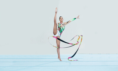 Poster - Gymnastics training, woman and ribbon with legs split for competition, sport and balance in portrait. Gymnast, athlete girl or professional dancer for concert, performance and contest with creativity