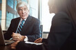 © Grady Reese/peopleimages.com - Exchanging business information. Cropped shot of two businesspeople working together in the boardroom.