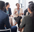© Talia Mdlungu/peopleimages.com - Business, meeting and black woman in discussion circle for team building, planning and collaboration in office. Happy group, employees and huddle for conversation, workshop and feedback for training