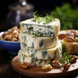 French Roquefort cheese close-up, blue cheese with noble mold penicillium roqueforti on a wooden board with herbs and walnuts