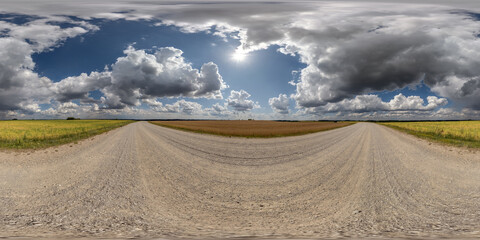 Wall Mural - 360 hdri panorama on white sand gravel road with clouds on blue sky in equirectangular spherical sea